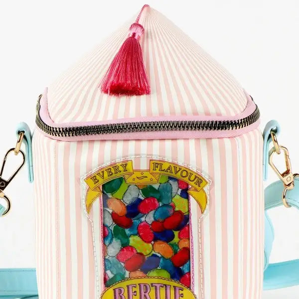 Cerdà Bertie Botts Candy Satchel with colorful assorted jelly beans in a clear bag, showcasing vibrant packaging and candies inside.